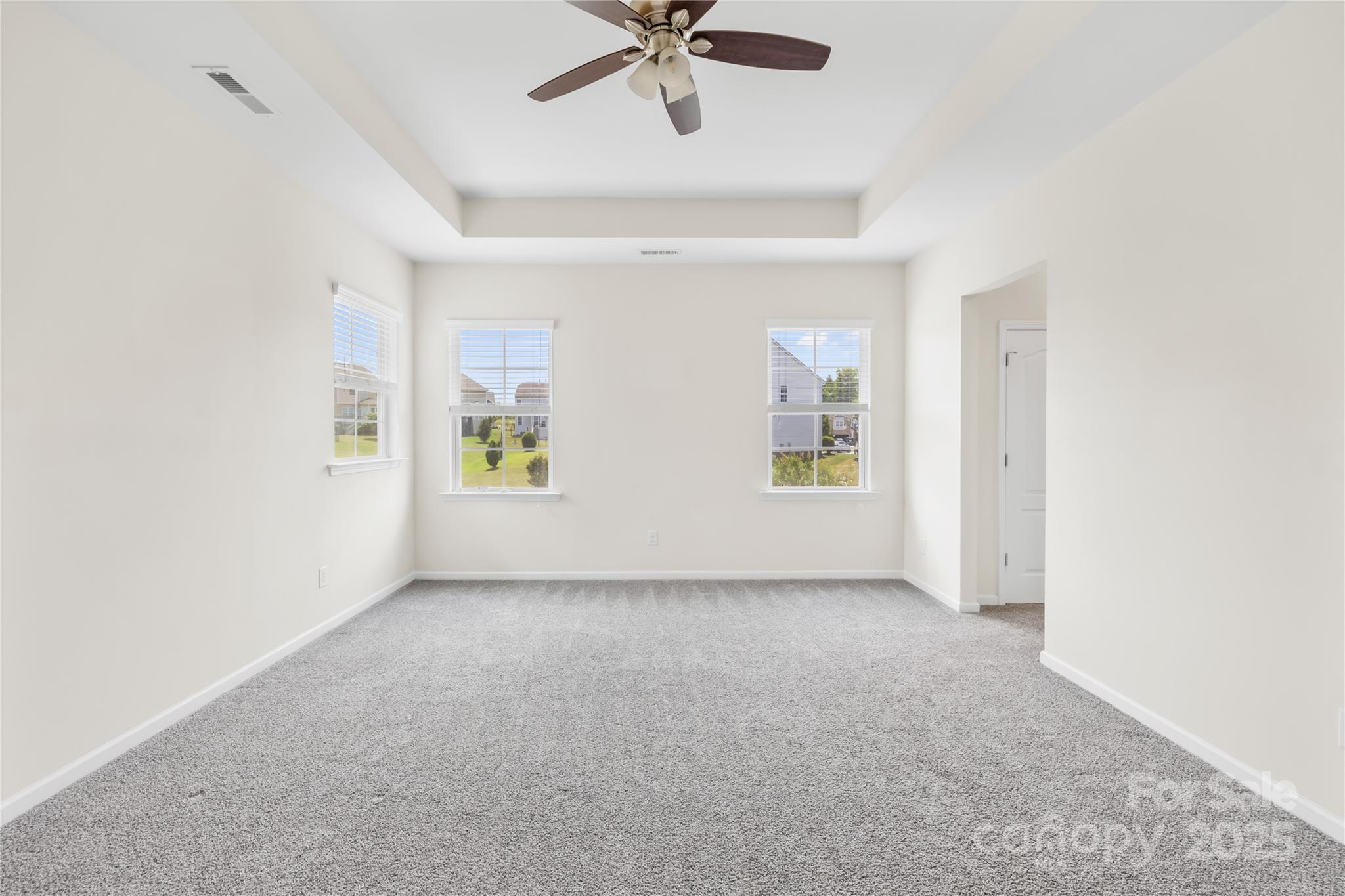 586 Brookhaven Drive Fort Mill, SC 29708 - Photo 32 of 47 an empty room with fan and windows