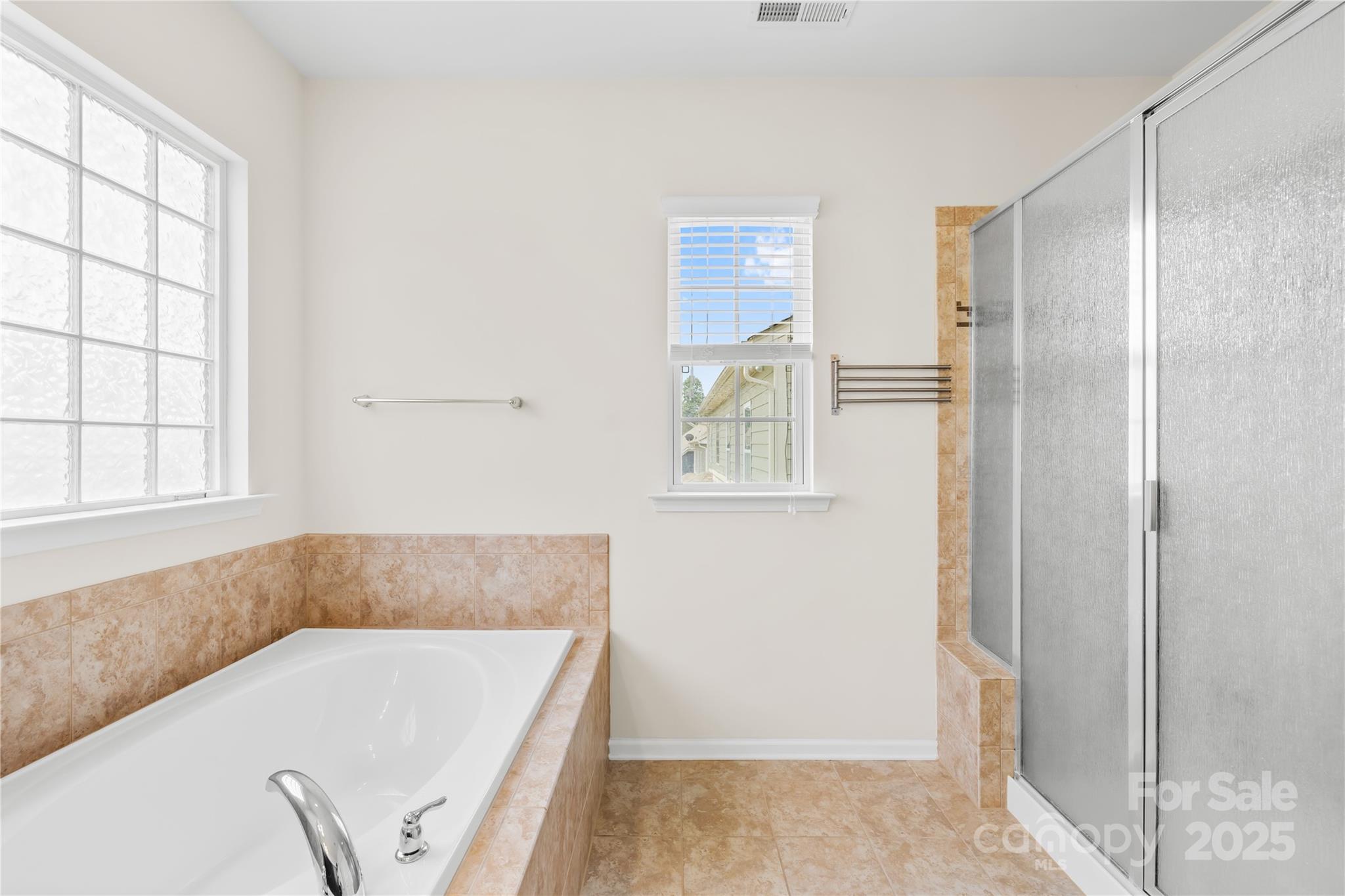 586 Brookhaven Drive Fort Mill, SC 29708 - Photo 35 of 47 a bathroom with a tub a sink and a window