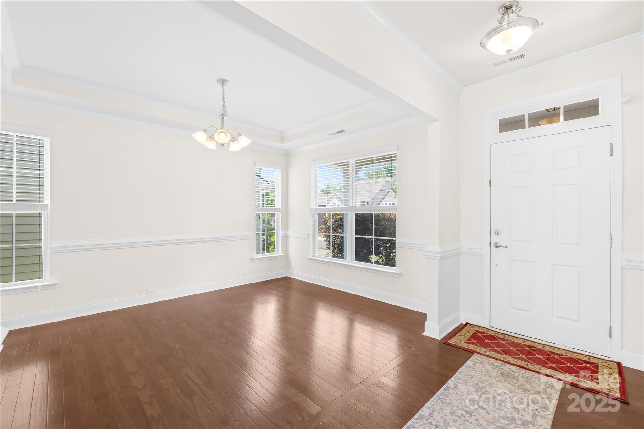 586 Brookhaven Drive Fort Mill, SC 29708 - Photo 8 of 47 an empty room with wooden floor and windows