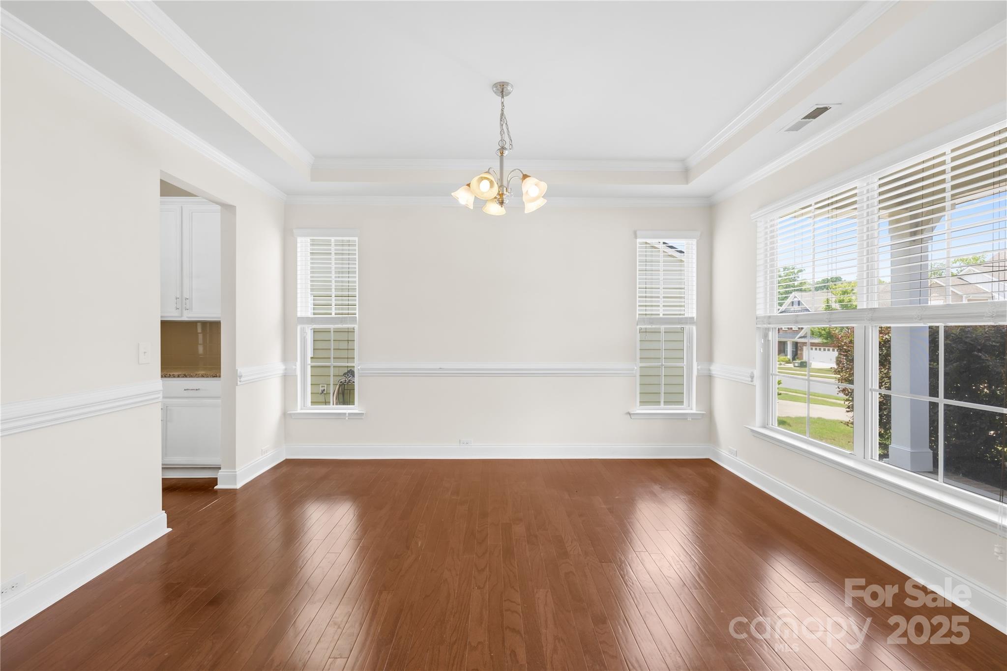 586 Brookhaven Drive Fort Mill, SC 29708 - Photo 9 of 47 a view of livingroom with hardwood floor and window
