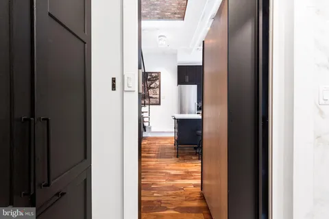 a view of a kitchen from the hallway