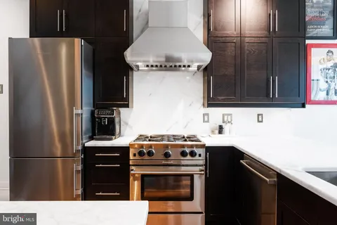 a kitchen with a stove microwave and refrigerator