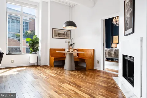 a bedroom with furniture and a fireplace