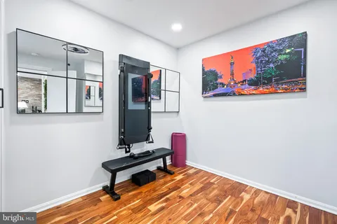 a room with furniture wall paintings and a window