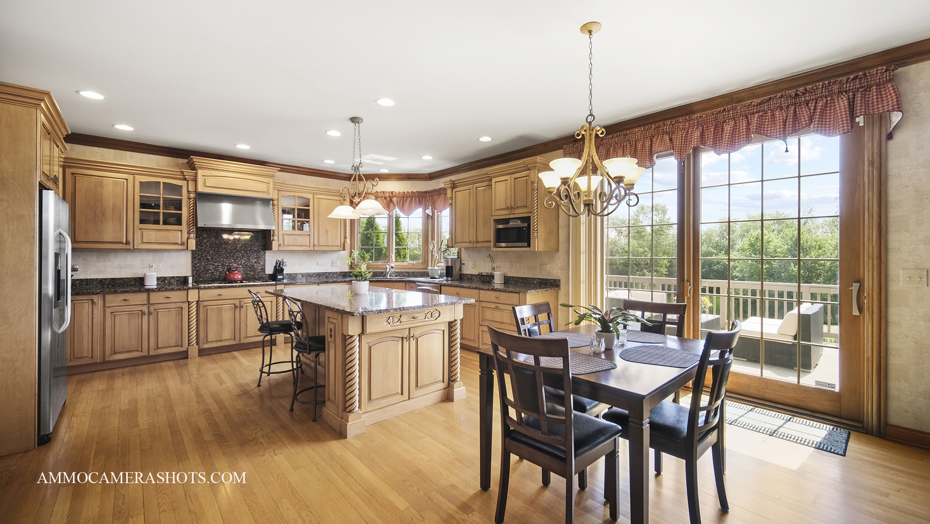 39W555 Walt Whitman Road St. Charles, IL 60175 - Photo 15 of 52 a kitchen with stainless steel appliances granite countertop a stove top oven a sink dishwasher a dining table and chairs with wooden floor