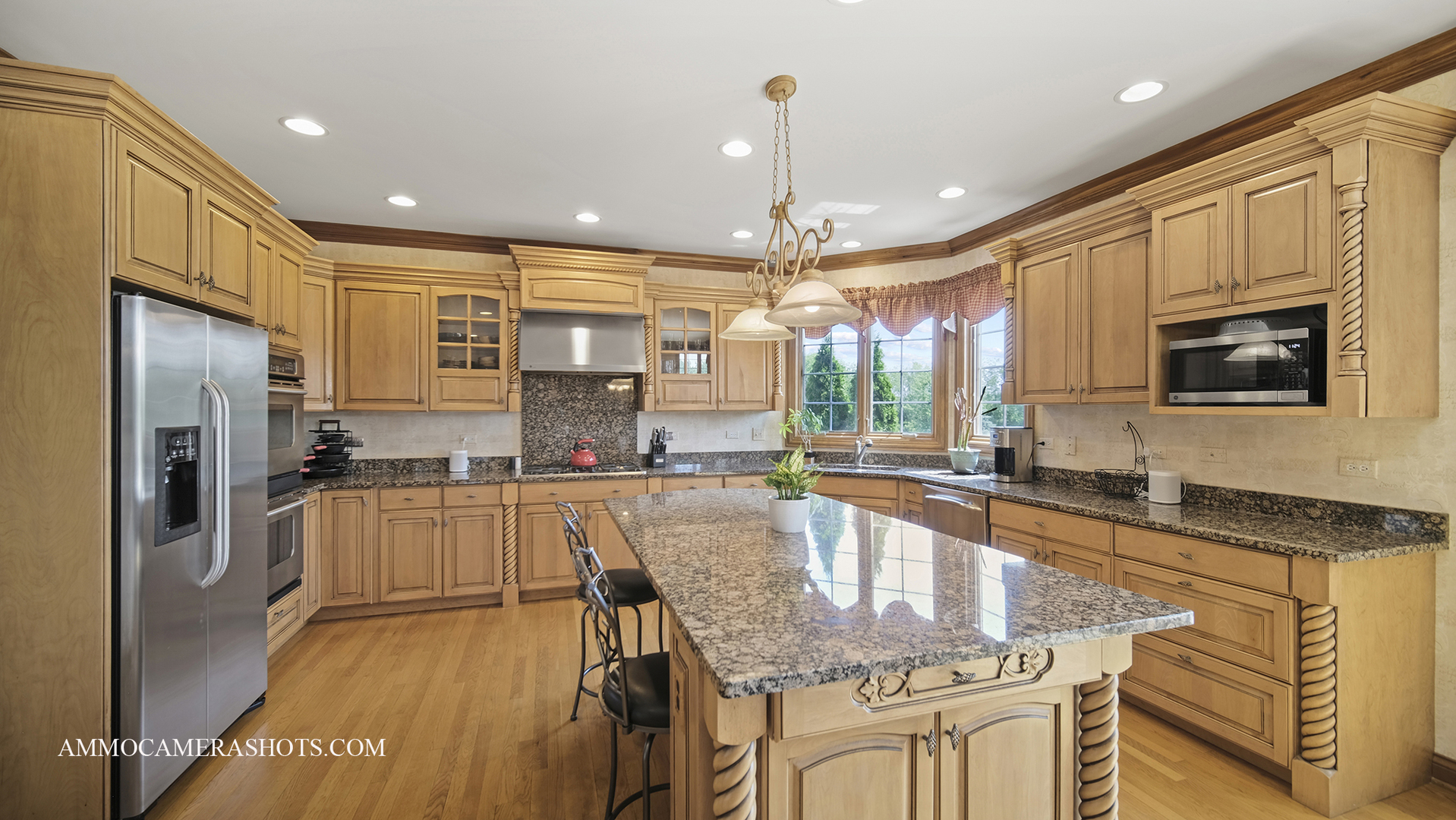 39W555 Walt Whitman Road St. Charles, IL 60175 - Photo 16 of 52 a large kitchen with granite countertop lots of counter space and a refrigerator
