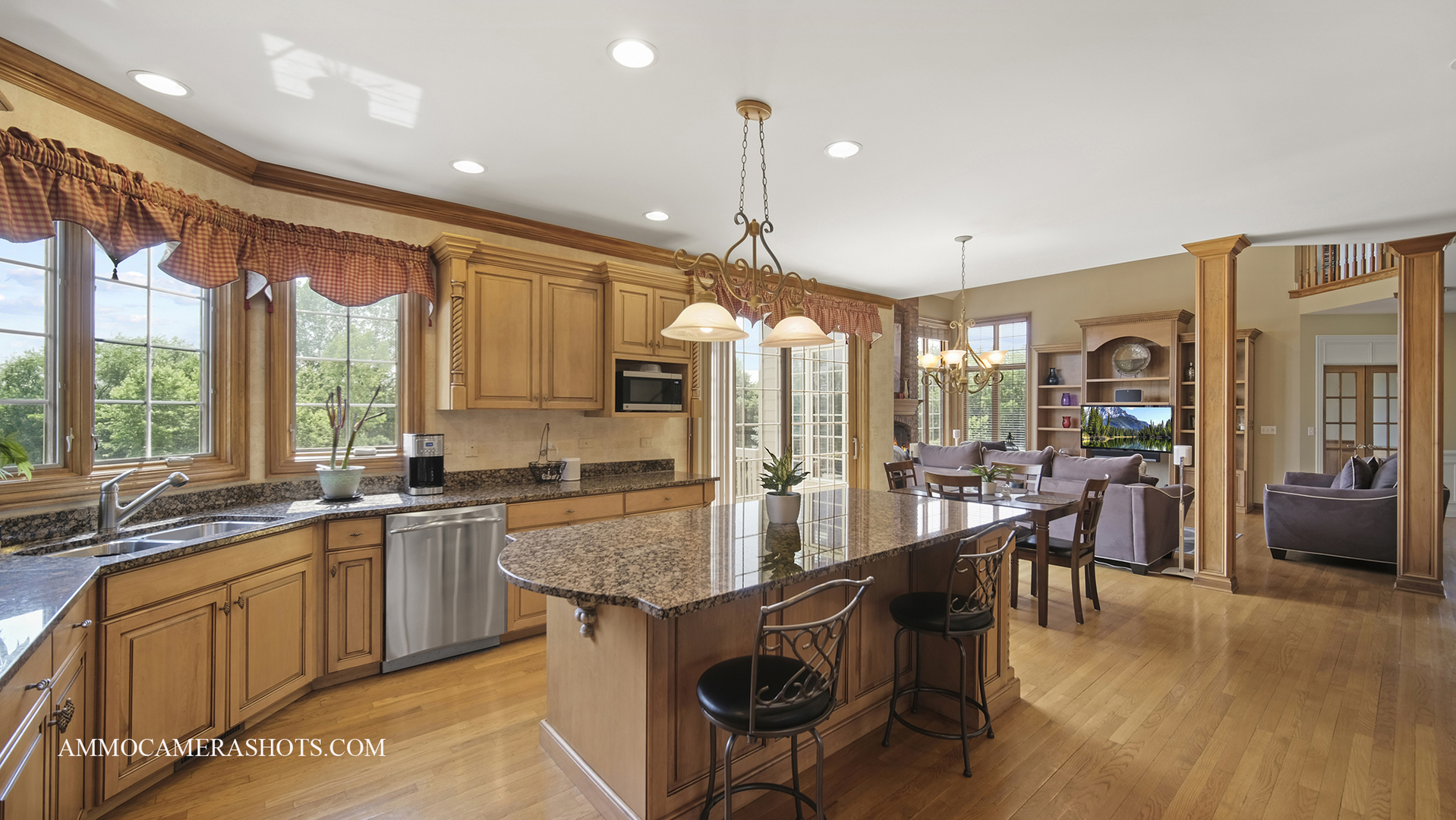 39W555 Walt Whitman Road St. Charles, IL 60175 - Photo 17 of 52 a large kitchen with kitchen island granite countertop a large window and stainless steel appliances