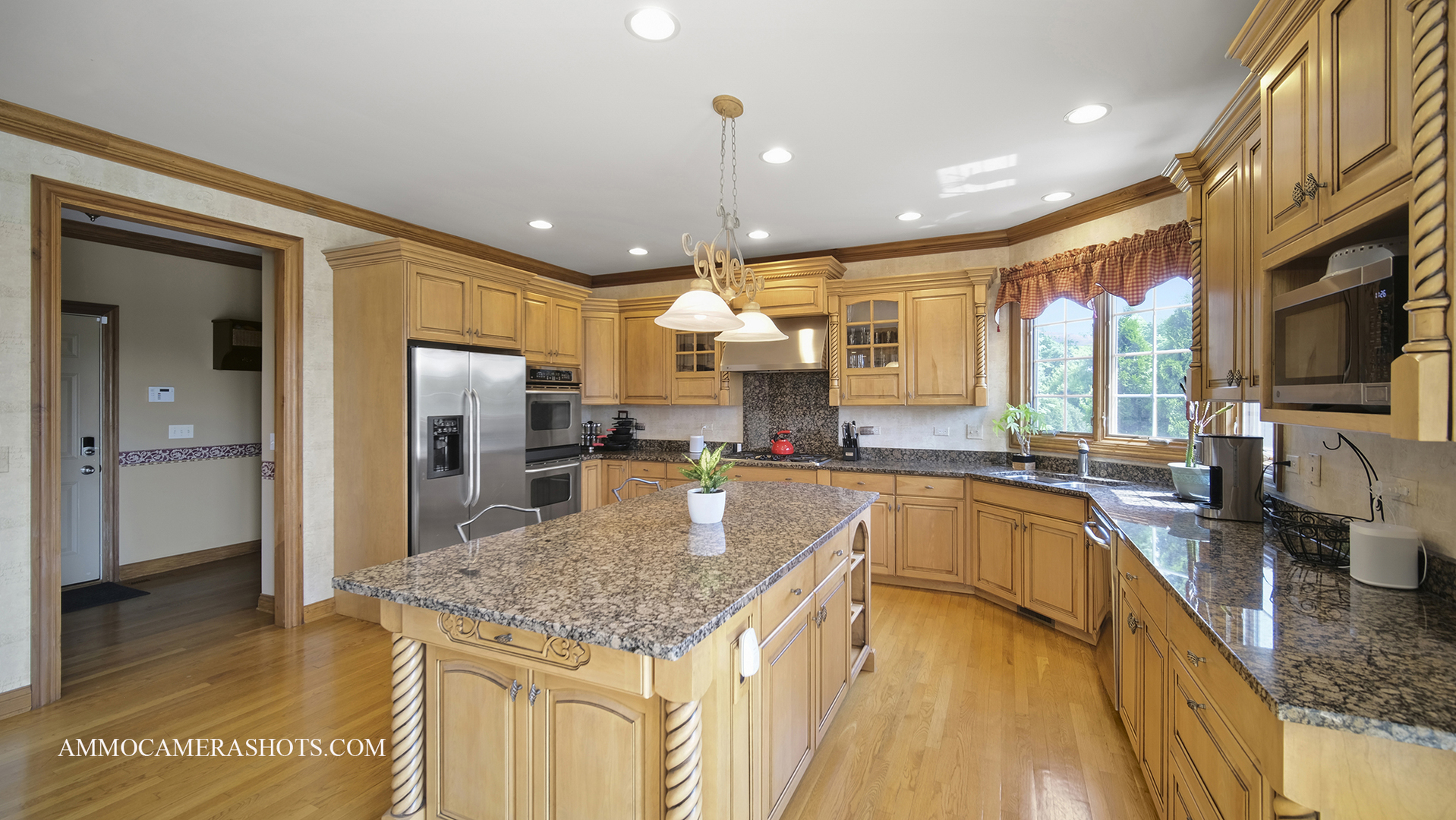 39W555 Walt Whitman Road St. Charles, IL 60175 - Photo 18 of 52 a kitchen with stainless steel appliances granite countertop a sink a stove and refrigerator
