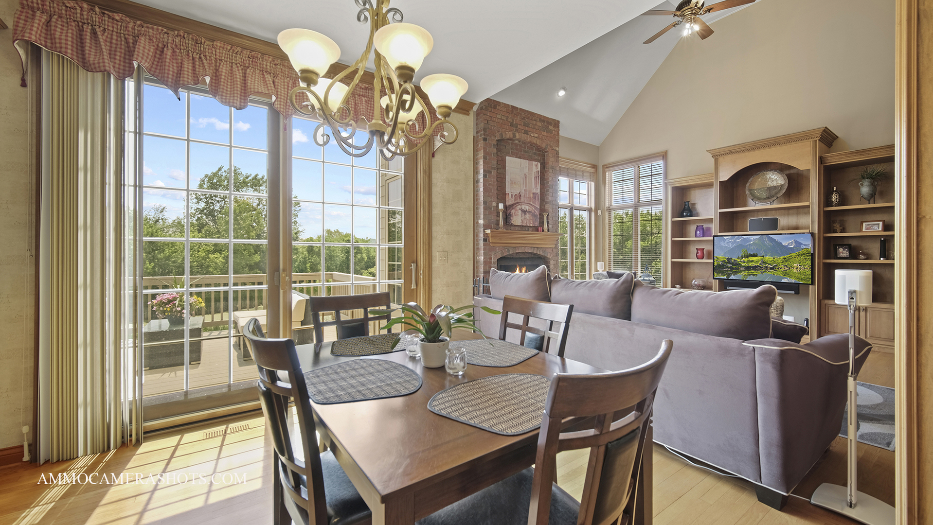 39W555 Walt Whitman Road St. Charles, IL 60175 - Photo 19 of 52 a view of a dining room with furniture a chandelier and large windows