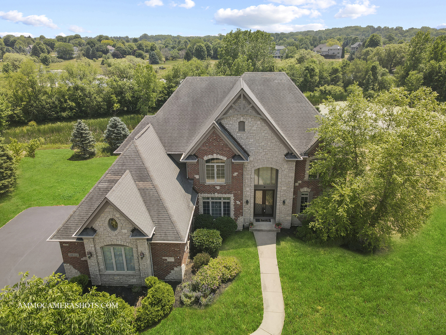 39W555 Walt Whitman Road St. Charles, IL 60175 - Photo 2 of 52 a aerial view of a house next to a yard