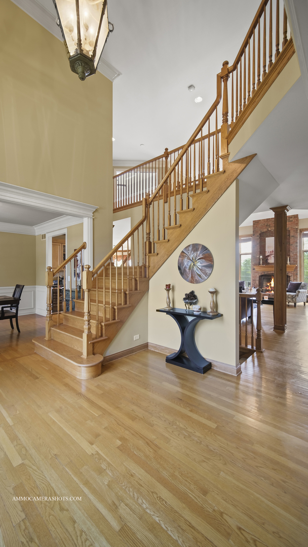 39W555 Walt Whitman Road St. Charles, IL 60175 - Photo 10 of 52 a view of entryway and hall with wooden floor