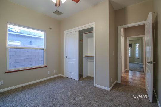 428 Abigail Street Ridgecrest, CA 93555 - Photo 19 of 34 an empty room with closet and windows