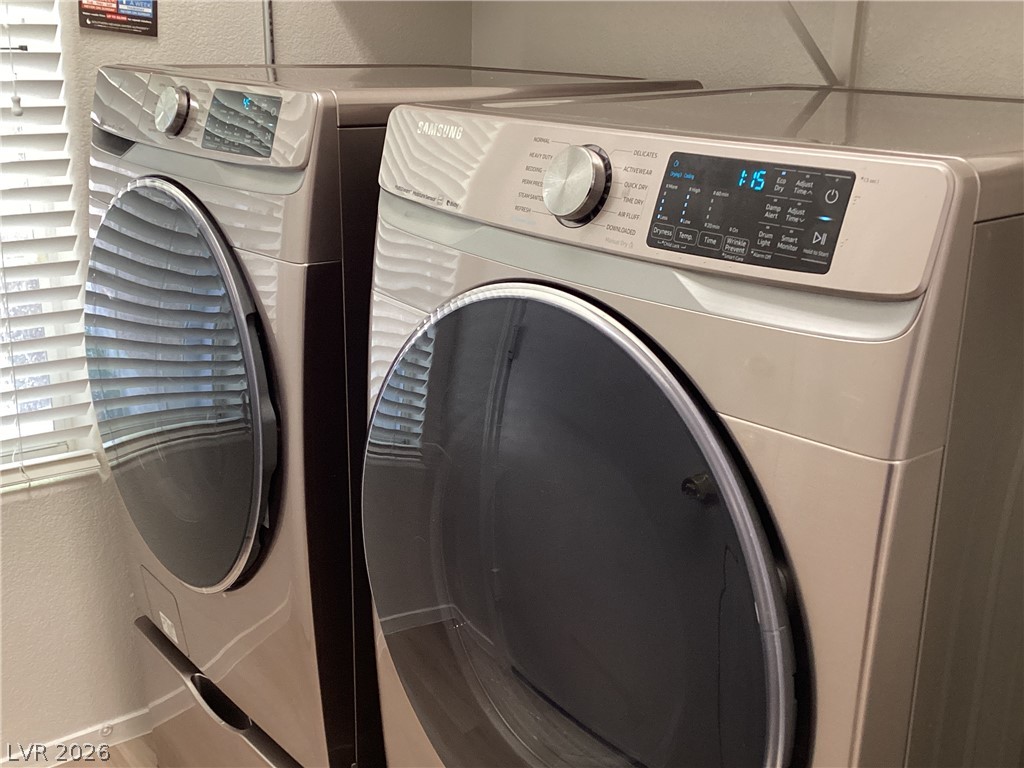 2135 Hidden Ranch Terrace Henderson, NV 89052 - Photo 9 of 27 Functional laundry room offers convenient, well-maintained washer and dryer units.