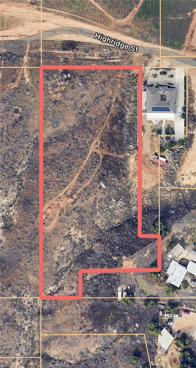 a street sign on a sidewalk next to a road