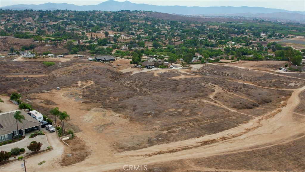 976 Highridge Street Riverside, CA 92506 - Photo 6 of 12 a view of a dry field with mountains in the background