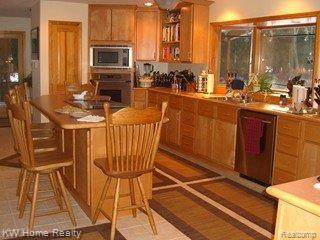 6768 Lakeshore Road Palms, MI 48465 - Photo 10 of 19 KITCHEN WITH ISLAND