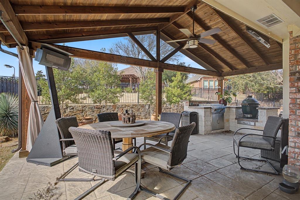 505 Scenic Ranch Circle Fairview, TX 75069 - Photo 1 of 32 a dining room with furniture and a floor to ceiling window