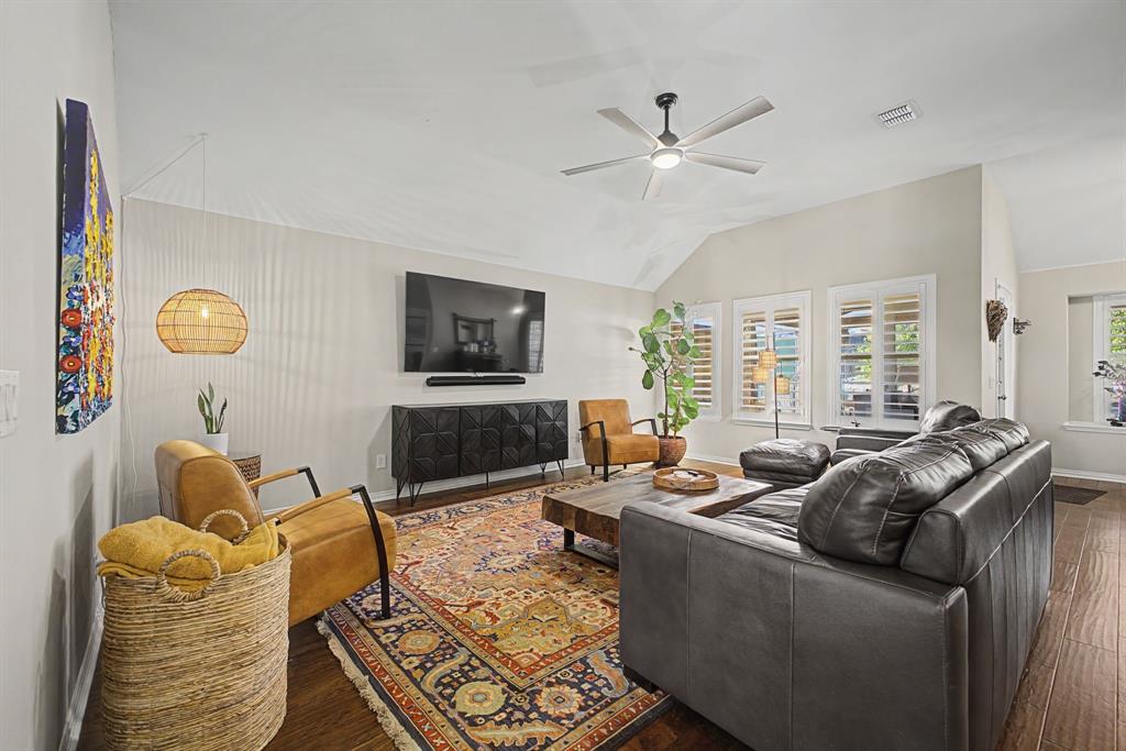 505 Scenic Ranch Circle Fairview, TX 75069 - Photo 11 of 32 a living room with furniture and a flat screen tv
