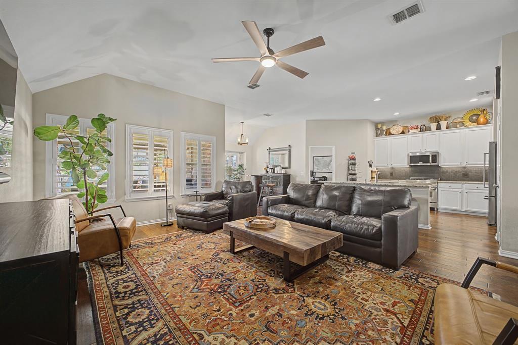 505 Scenic Ranch Circle Fairview, TX 75069 - Photo 12 of 32 a living room with furniture kitchen view and a large window
