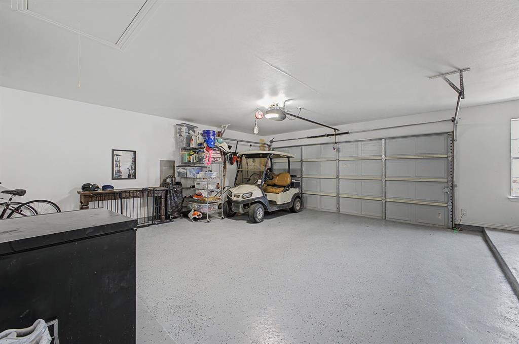 505 Scenic Ranch Circle Fairview, TX 75069 - Photo 21 of 32 a view of a garage with storage
