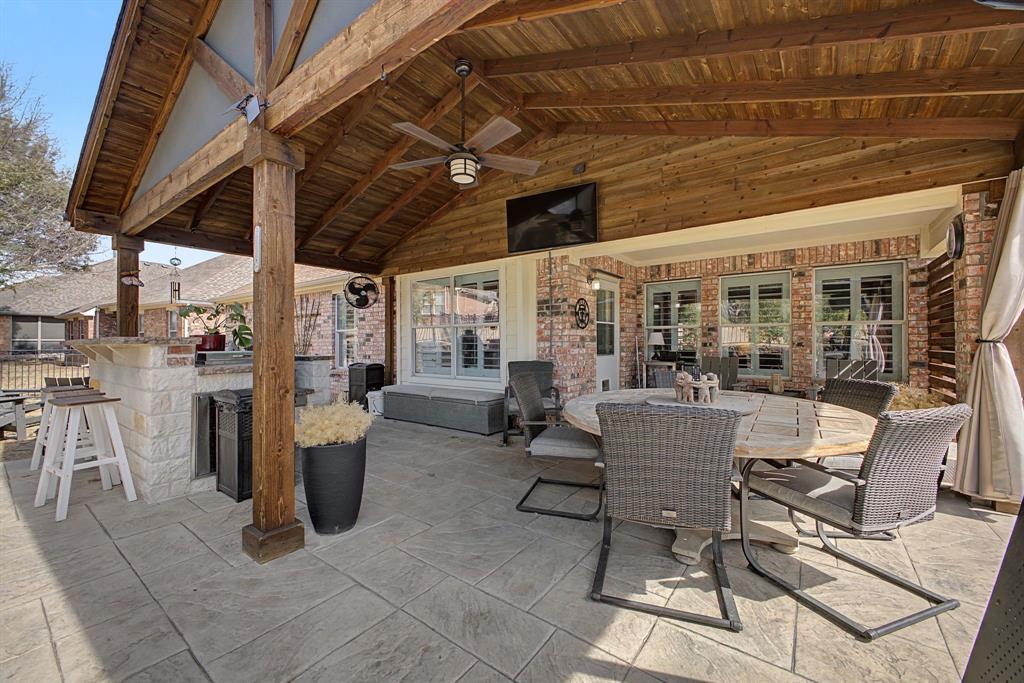505 Scenic Ranch Circle Fairview, TX 75069 - Photo 27 of 32 a view of a chairs and table in a patio
