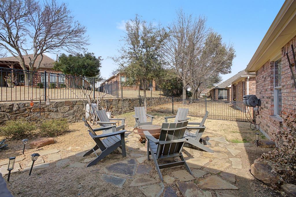 505 Scenic Ranch Circle Fairview, TX 75069 - Photo 28 of 32 a view of a patio with a table and chairs