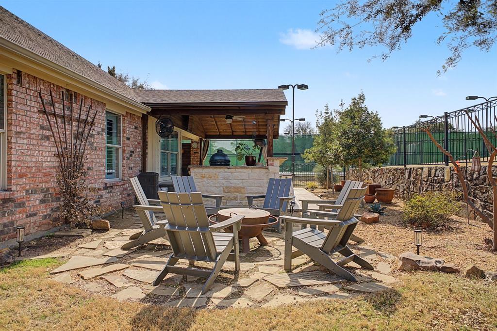 505 Scenic Ranch Circle Fairview, TX 75069 - Photo 29 of 32 a view of a patio with table and chairs and potted plants