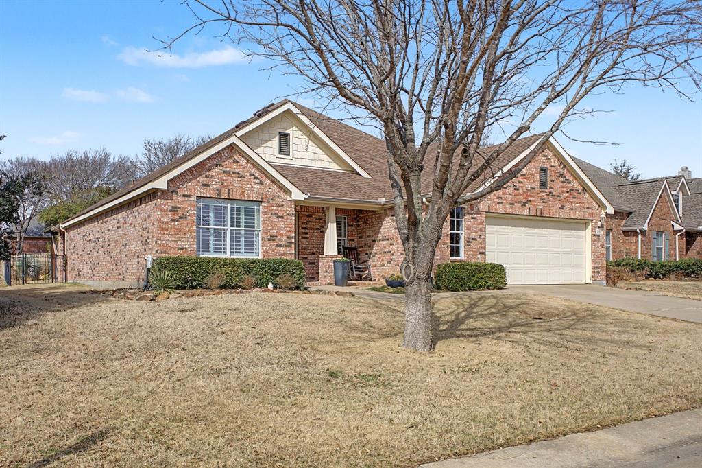 505 Scenic Ranch Circle Fairview, TX 75069 - Photo 3 of 32 a front view of a house with a yard and garage
