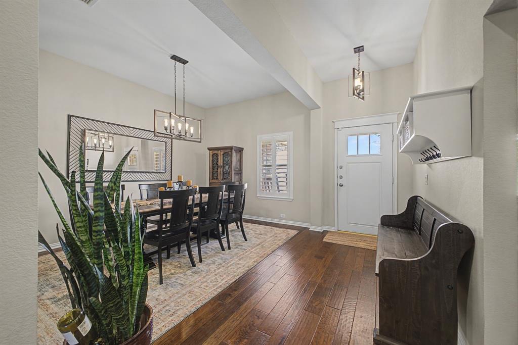 505 Scenic Ranch Circle Fairview, TX 75069 - Photo 5 of 32 a view of a dining room with furniture window and wooden floor