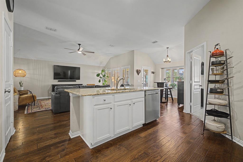 505 Scenic Ranch Circle Fairview, TX 75069 - Photo 8 of 32 a kitchen with stainless steel appliances a stove top oven a sink a refrigerator and cabinets