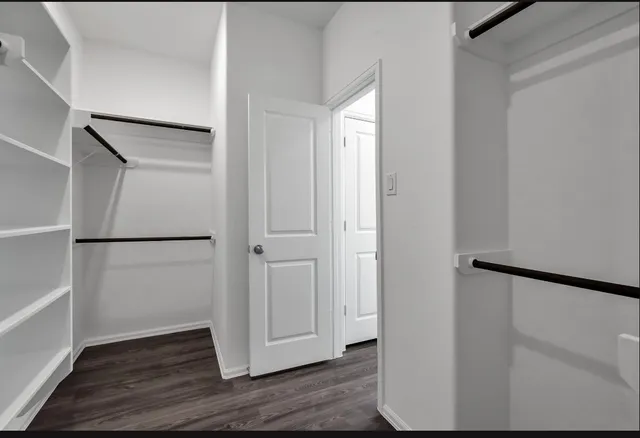 a bathroom with a tub sink shower and mirror