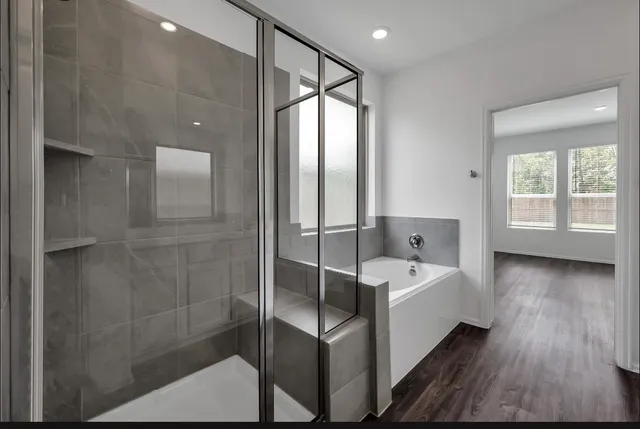 a bathroom with a double vanity sink and a large mirror