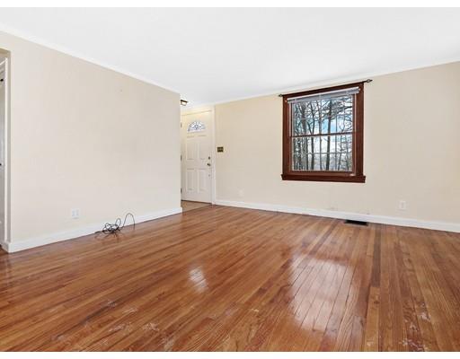 37 Harwood Road Natick, MA 01760 - Photo 3 of 18 an empty room with wooden floor and windows