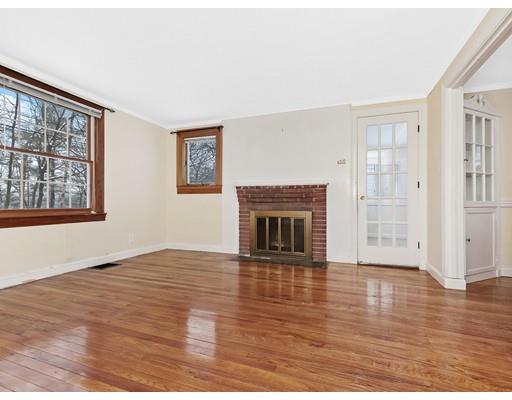 37 Harwood Road Natick, MA 01760 - Photo 4 of 18 a view of an empty room with wooden floor fireplace and a window
