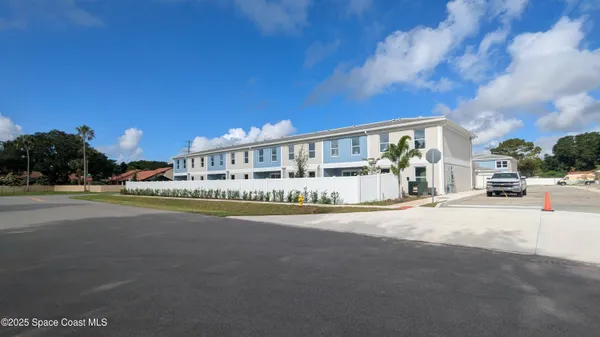 a view of a building with a street