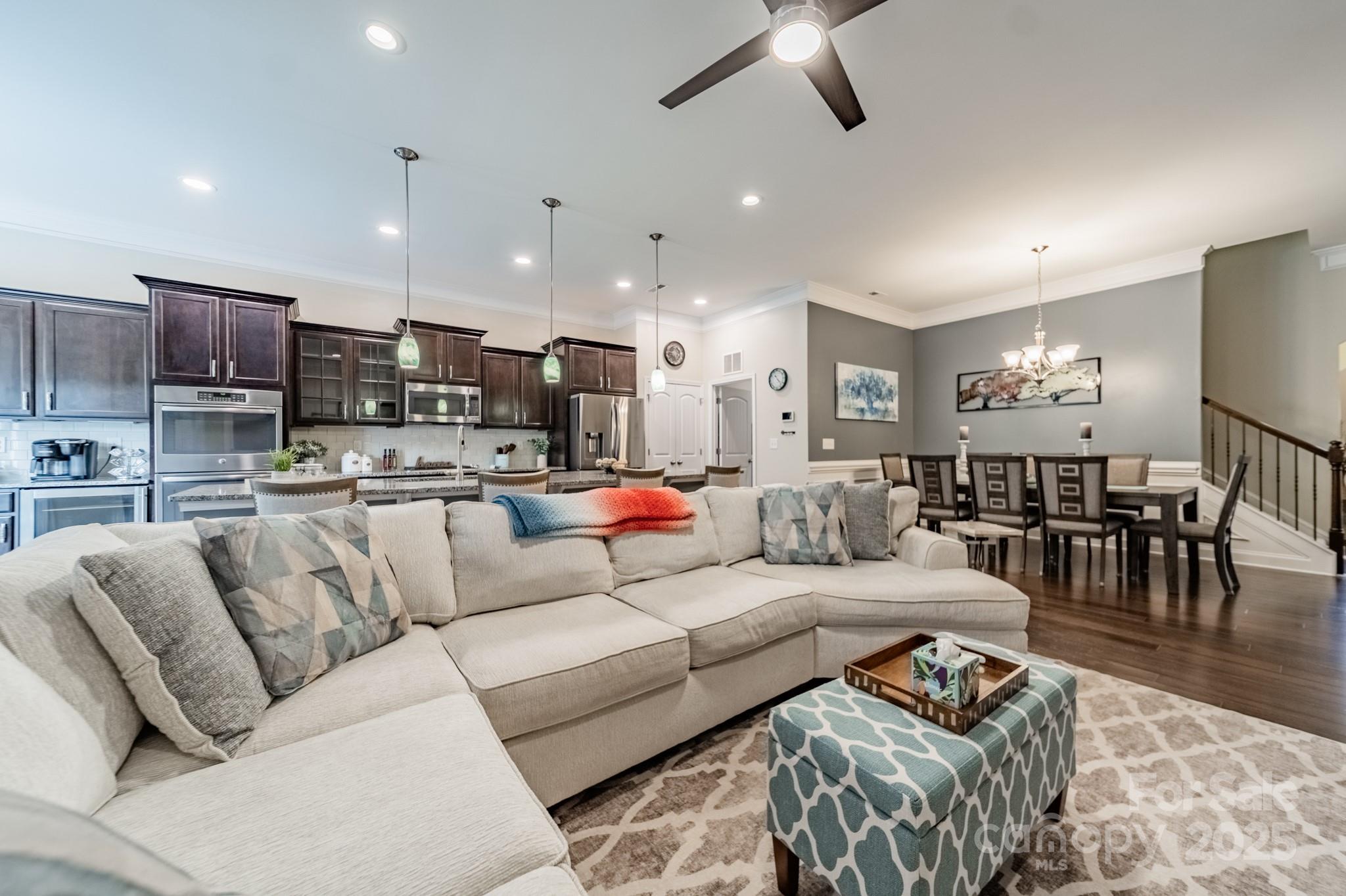 3419 Streamside Drive, Unit 463 Davidson, NC 28036 - Photo 11 of 43 a living room with furniture and kitchen view