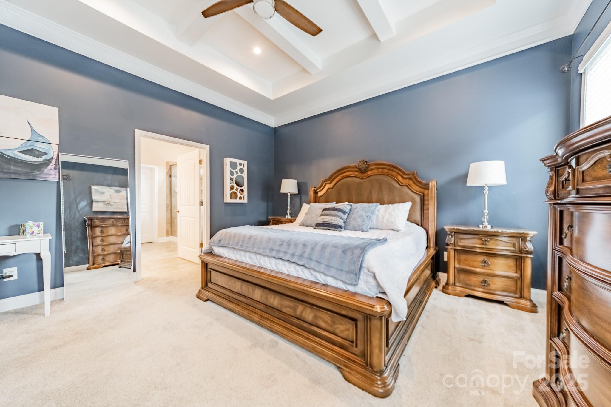 3419 Streamside Drive, Unit 463 Davidson, NC 28036 - Photo 14 of 43 a bedroom with a bed and a chandelier