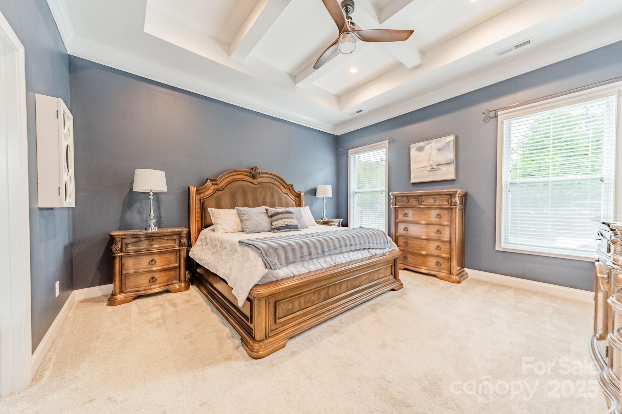 3419 Streamside Drive, Unit 463 Davidson, NC 28036 - Photo 15 of 43 a bedroom with a bed wooden floor and window