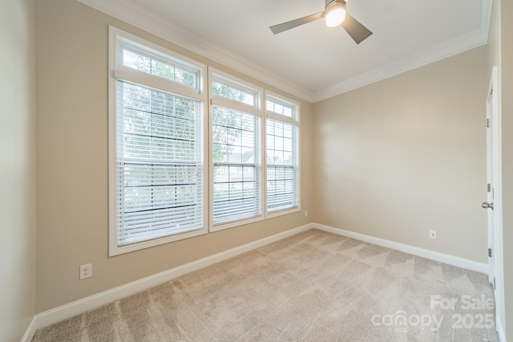 3419 Streamside Drive, Unit 463 Davidson, NC 28036 - Photo 20 of 43 a view of an empty room with a window