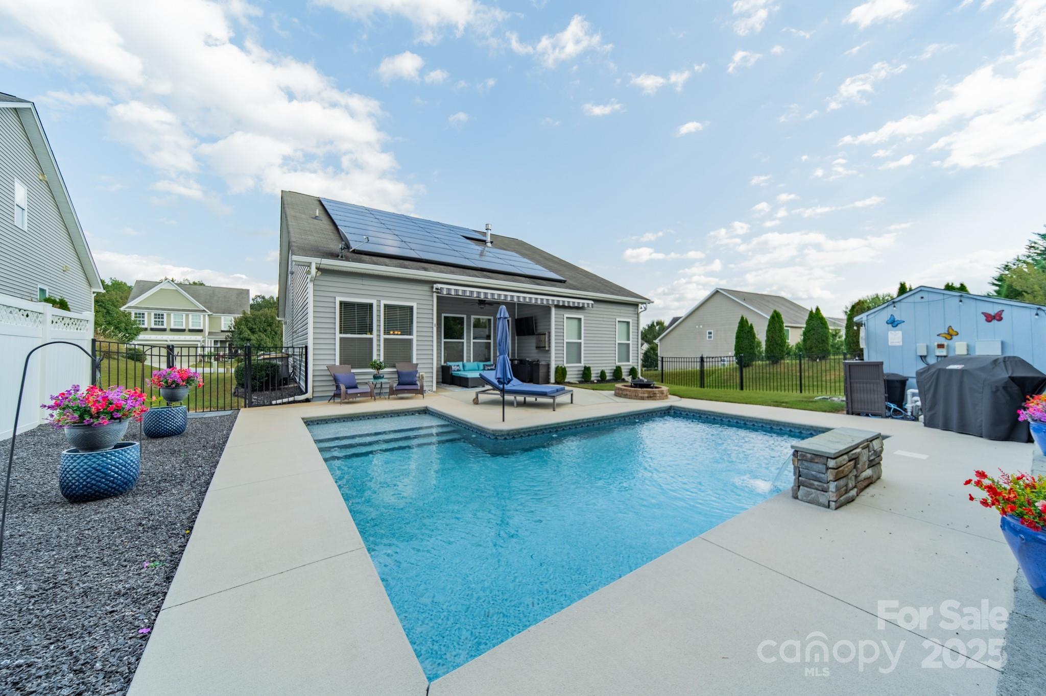 3419 Streamside Drive, Unit 463 Davidson, NC 28036 - Photo 2 of 43 a view of a house with swimming pool and sitting area