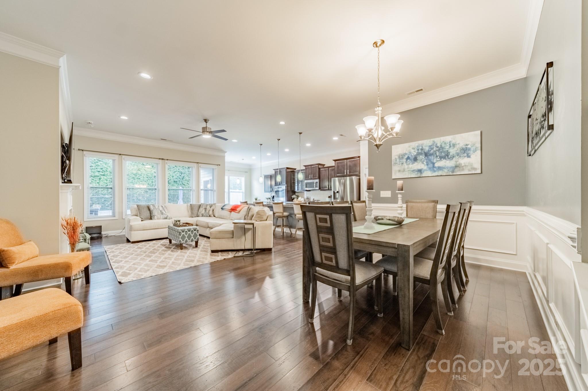 3419 Streamside Drive, Unit 463 Davidson, NC 28036 - Photo 4 of 43 a view of a dining room with furniture window and wooden floor