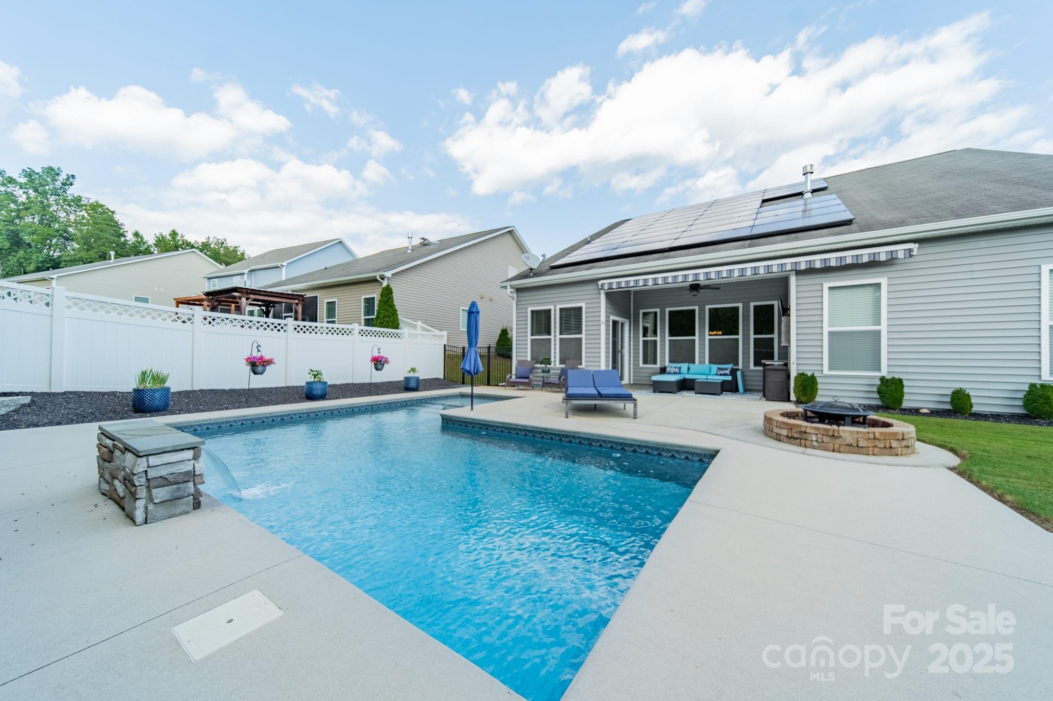 3419 Streamside Drive, Unit 463 Davidson, NC 28036 - Photo 41 of 43 a view of a house with swimming pool and sitting area