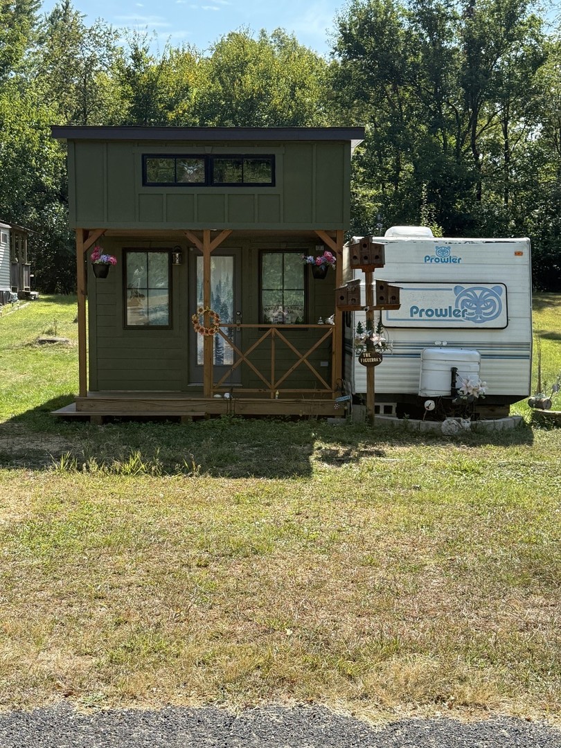6-19 Woodhaven Lakes Sublette, IL 61367 - Photo 2 of 24 a front view of a house with a yard