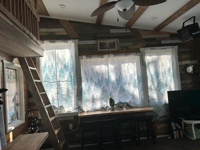 a view of a room with a large window