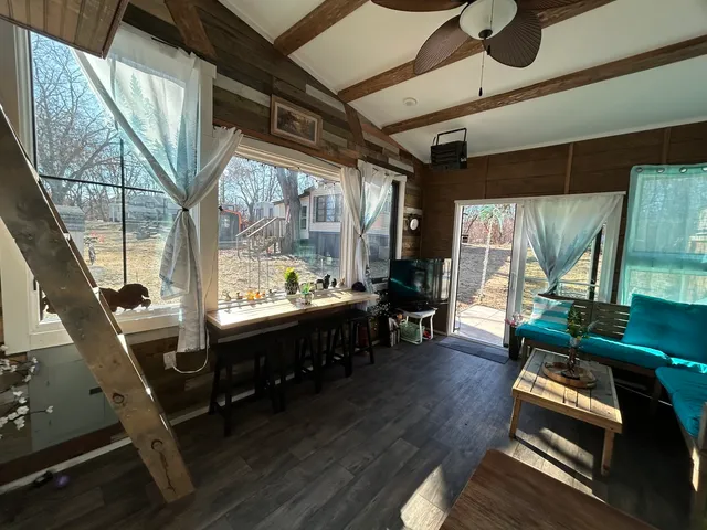 a room with furniture and a large window