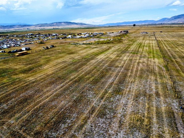 1882 Stockyard Road Montpelier, ID 83254 - Photo 13 of 16 Expansive open field with distant mountains and a partially visible fence line