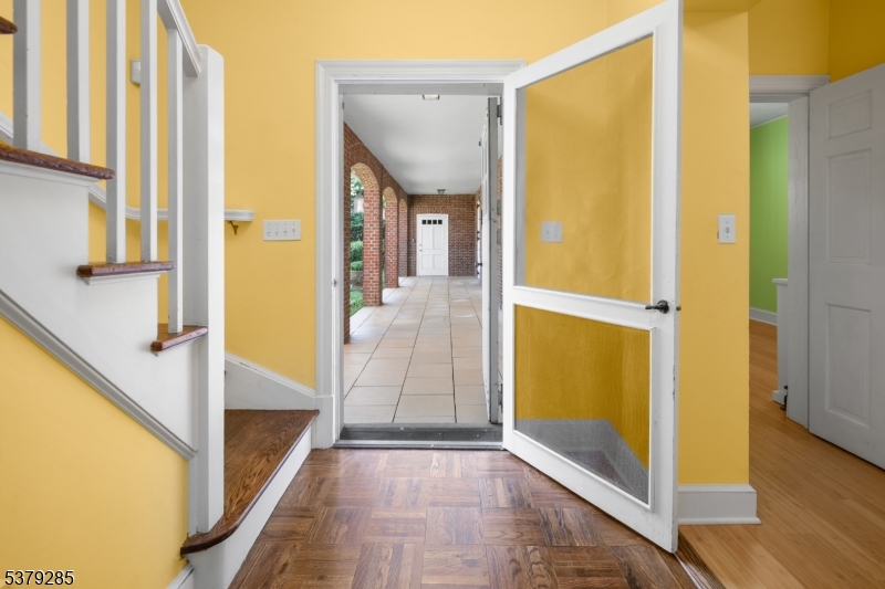 49 Liberty Corner Road Bernards, NJ 07931 - Photo 11 of 23 a view of a hallway with wooden floor and a bathroom