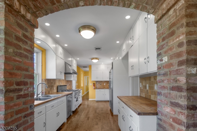 49 Liberty Corner Road Bernards, NJ 07931 - Photo 16 of 50 a large kitchen with a sink and a stove top oven