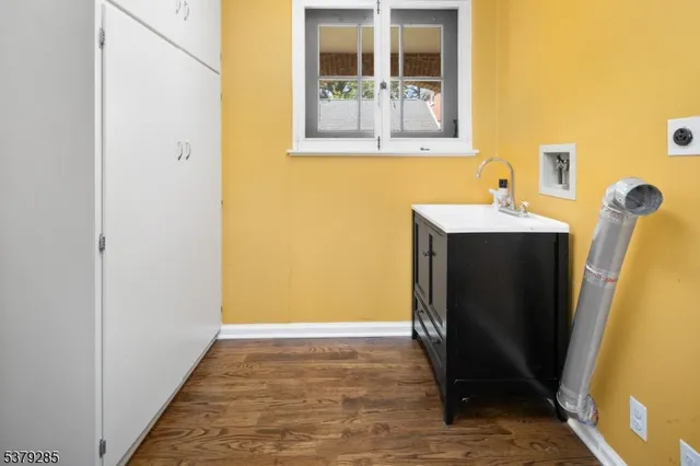 a bathroom with a sink and mirror