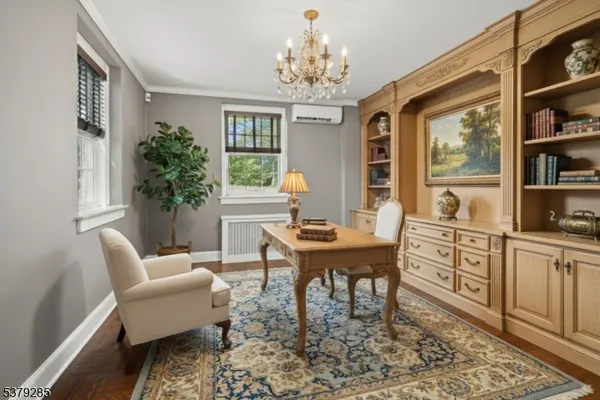 a dining room with furniture a rug and wooden floor